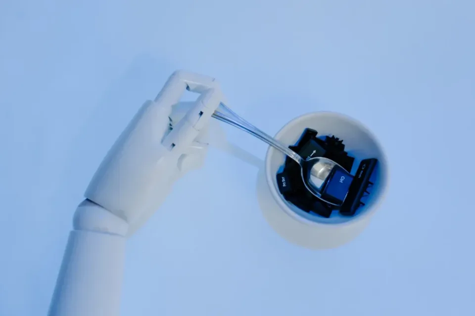 Futuristic robotic arm interacting with digital components, symbolizing AI in game development